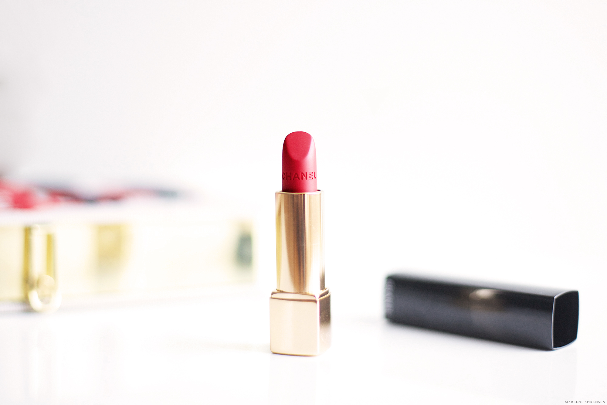A Chanel lipstick photographed against a white background